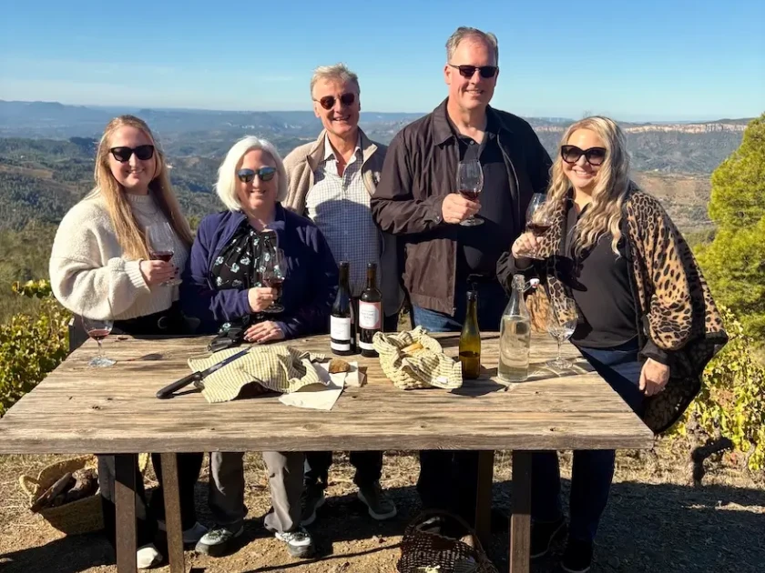 A group wine tasting in a vineyard of the priorat