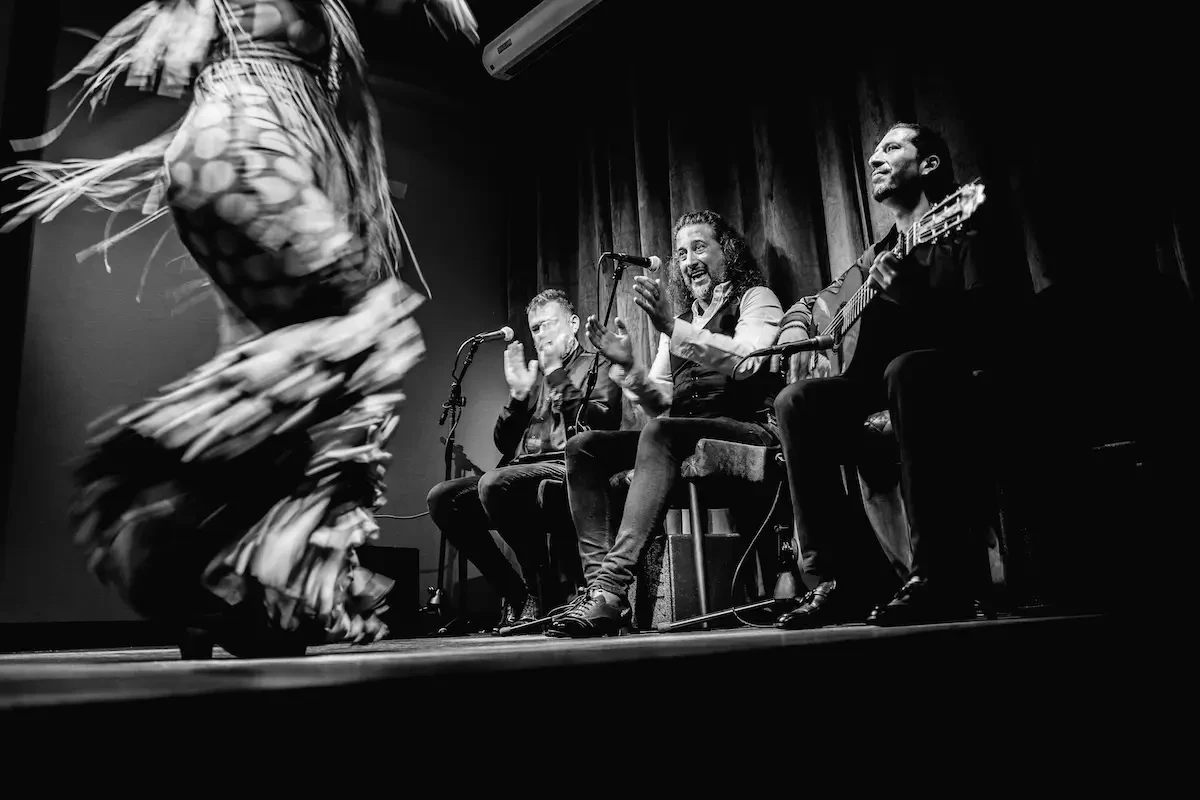 A flamenco dancer and musicians performing