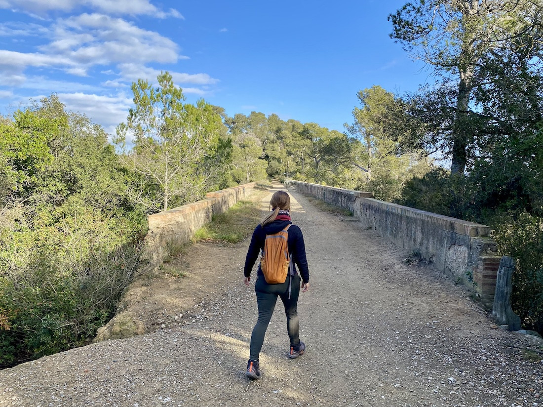 A hiker on a bridge in Collserola Park, barcelona