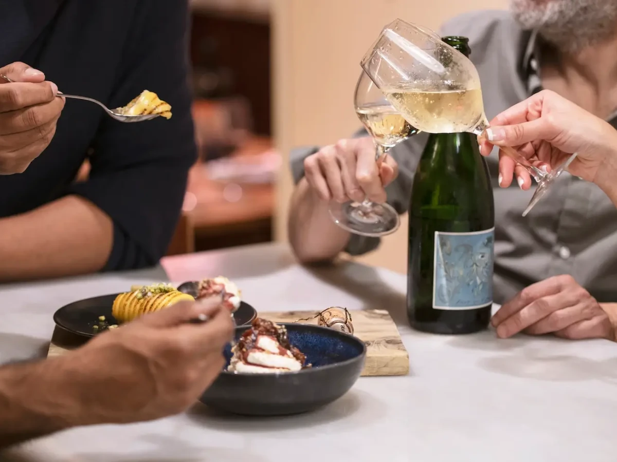 a group sharing some tapas and drinking cava