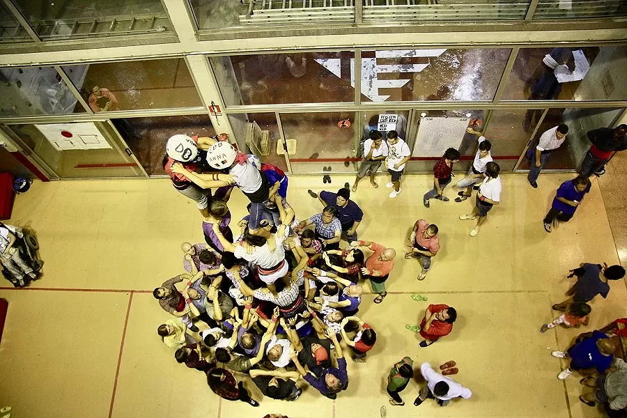 The Castellers of Barcelona building a human tower, seen from above