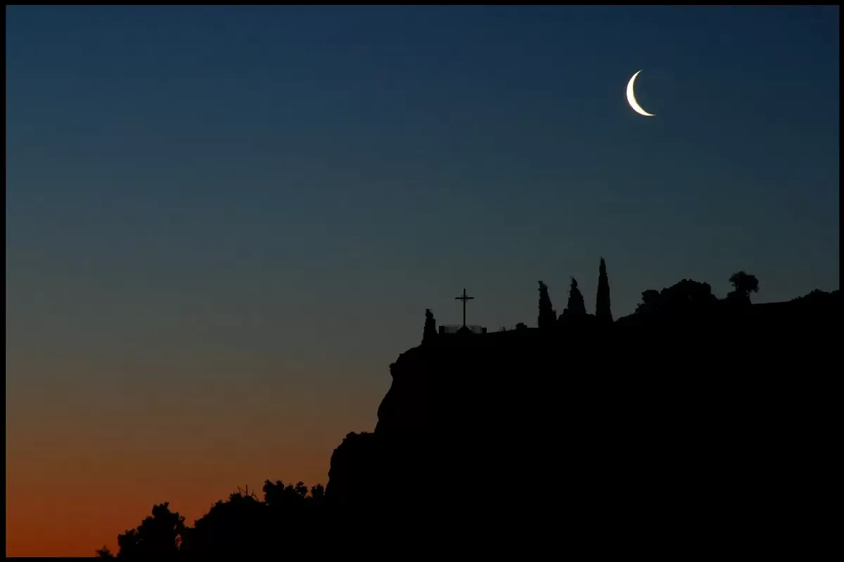 Montserrat mountain at night with waning moon